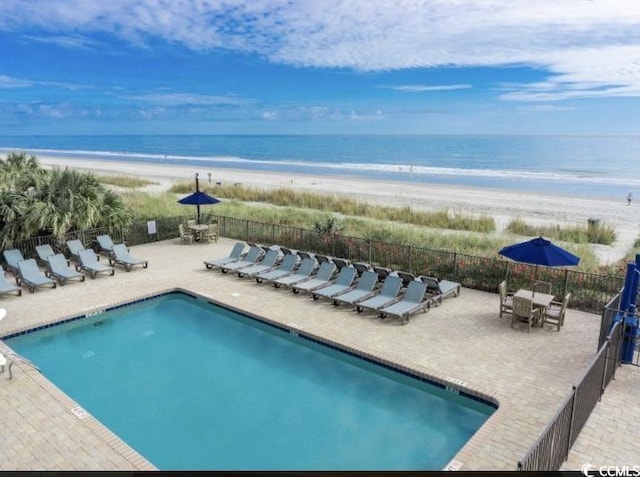 2001 S Ocean Blvd Unit 621, Myrtle Beach, SC 29577 - pool with fence, outdoor dining area, a view of the beach, a patio area, and a water view