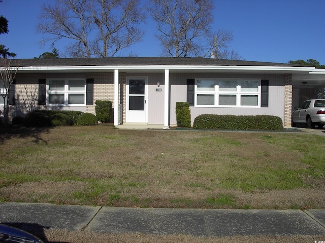 3752 Tea Rose St Unit 3752, Myrtle Beach, SC 29577 - ranch-style house featuring brick siding, a front lawn, and a carport