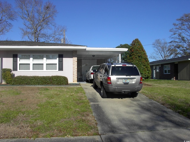 3752 Tea Rose St Unit 3752, Myrtle Beach, SC 29577 - view of front facade featuring a carport, driveway, and a front yard