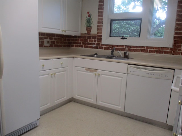 3752 Tea Rose St Unit 3752, Myrtle Beach, SC 29577 - kitchen with white appliances, a sink, backsplash, and white cabinetry