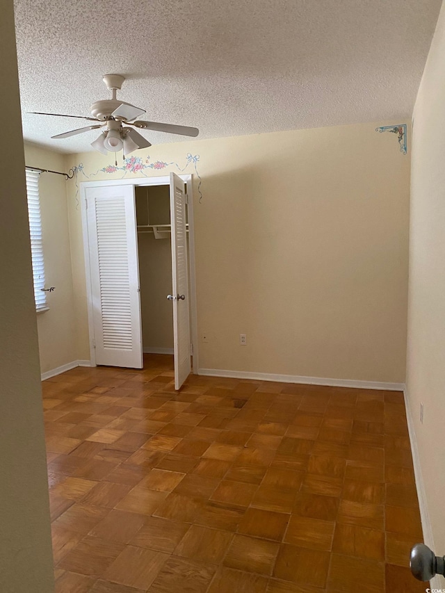 3752 Tea Rose St Unit 3752, Myrtle Beach, SC 29577 - empty room with a textured ceiling, ceiling fan, and baseboards