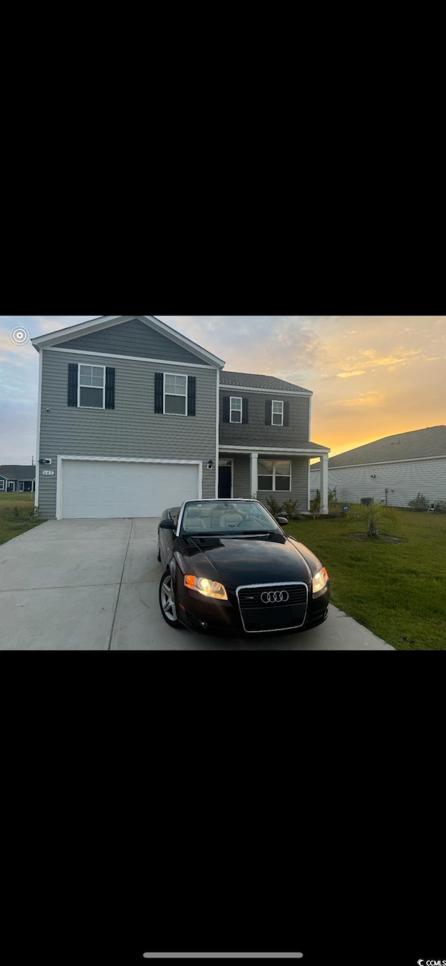 645 Black Pearl Way, Myrtle Beach, SC 29588 - view of front of house featuring a garage, driveway, and a front yard