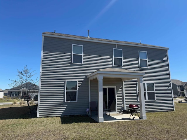645 Black Pearl Way, Myrtle Beach, SC 29588 - rear view of property featuring a lawn and a patio