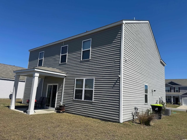 645 Black Pearl Way, Myrtle Beach, SC 29588 - rear view of house featuring a lawn and a patio area