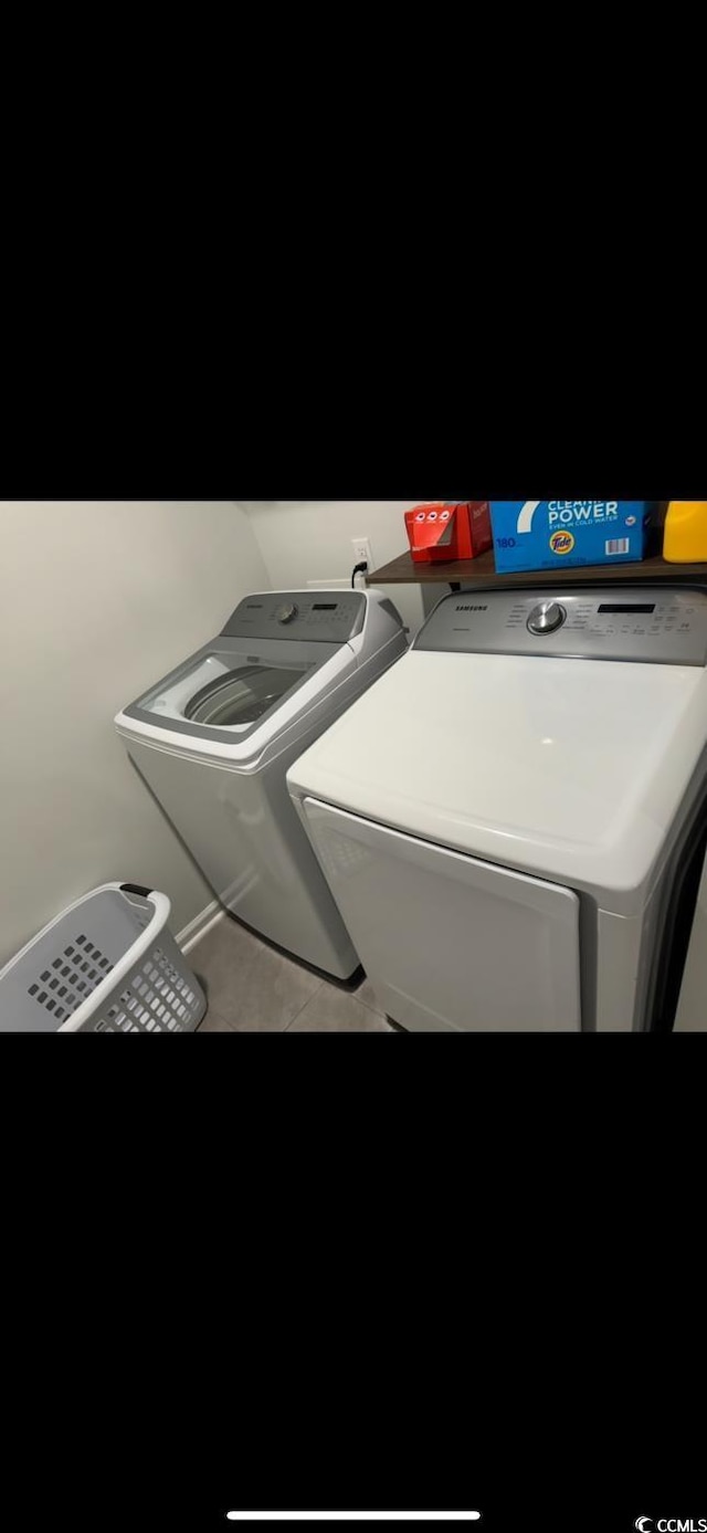 645 Black Pearl Way, Myrtle Beach, SC 29588 - washroom featuring washer and clothes dryer and tile patterned floors