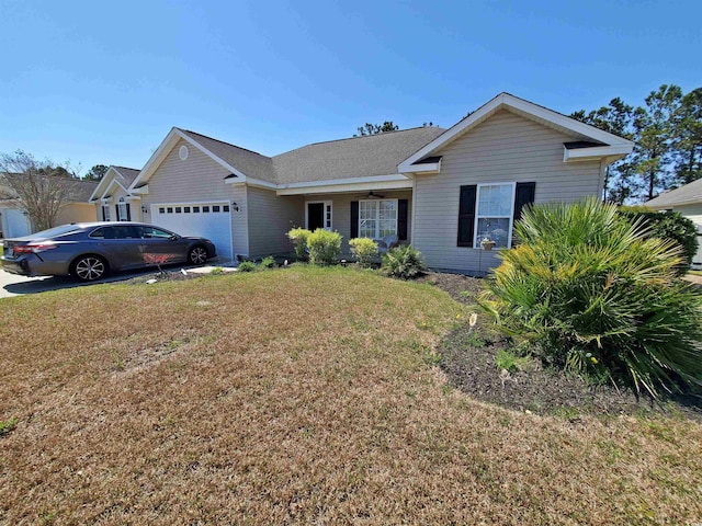 single story home featuring a front lawn, an attached garage, and a ceiling fan