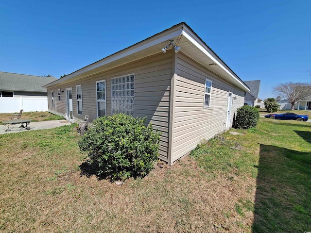 view of side of home with a patio