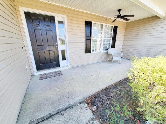 view of front facade featuring an attached garage, concrete driveway, and view of scattered trees