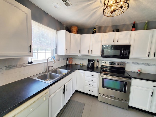kitchen featuring black microwave, electric range, a sink, white dishwasher, and dark countertops