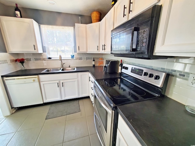 kitchen featuring stainless steel range with electric stovetop, black microwave, white dishwasher, a sink, and dark countertops
