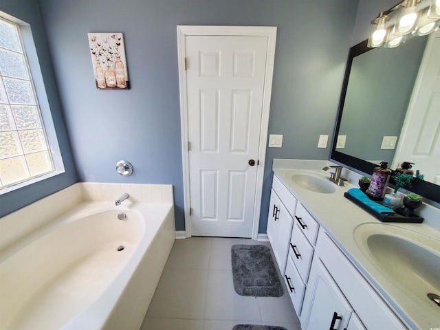 bathroom featuring tile patterned flooring, double vanity, and a bath