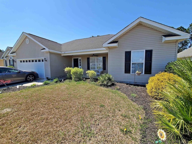 single story home with a garage, a front yard, and ceiling fan