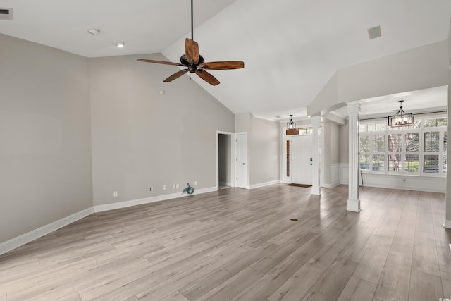 unfurnished living room featuring visible vents, baseboards, ceiling fan with notable chandelier, light wood finished floors, and ornate columns