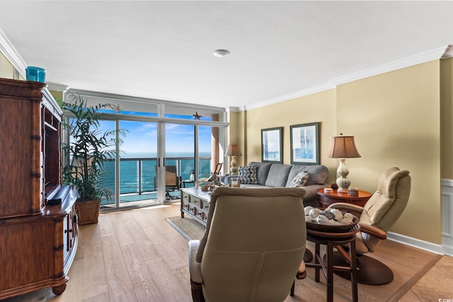 5700 N Ocean Blvd Unit 1107, North Myrtle Beach, SC 29582 - living area featuring crown molding, light wood finished floors, and a water view