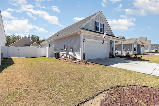 294 Portofino Dr, Myrtle Beach, SC 29579 - view of side of home featuring driveway, board and batten siding, a garage, and a gate