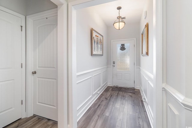 294 Portofino Dr, Myrtle Beach, SC 29579 - entryway featuring a wainscoted wall, dark wood-style flooring, and a decorative wall