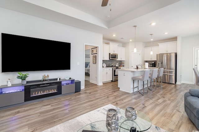 294 Portofino Dr, Myrtle Beach, SC 29579 - living area featuring light wood-style flooring, a ceiling fan, and recessed lighting