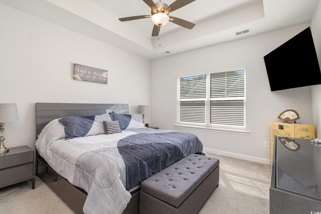 294 Portofino Dr, Myrtle Beach, SC 29579 - bedroom with a tray ceiling, light carpet, and ceiling fan