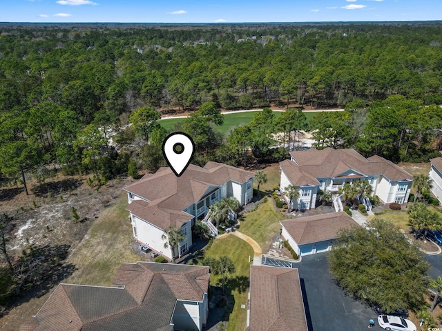 77 Tern Pl Unit 202, Pawleys Island, SC 29585 - aerial overview of property's location with a heavily wooded area and nearby suburban area