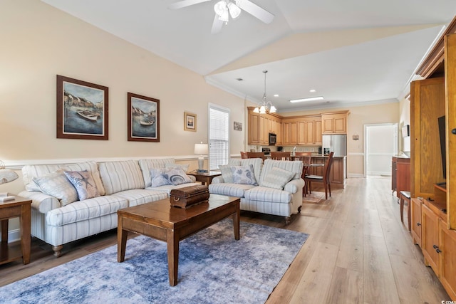 77 Tern Pl Unit 202, Pawleys Island, SC 29585 - living room with ceiling fan, light wood-style flooring, crown molding, a chandelier, and lofted ceiling