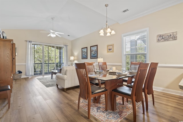 77 Tern Pl Unit 202, Pawleys Island, SC 29585 - dining room featuring hardwood / wood-style floors, a ceiling fan, vaulted ceiling, baseboards, and a chandelier