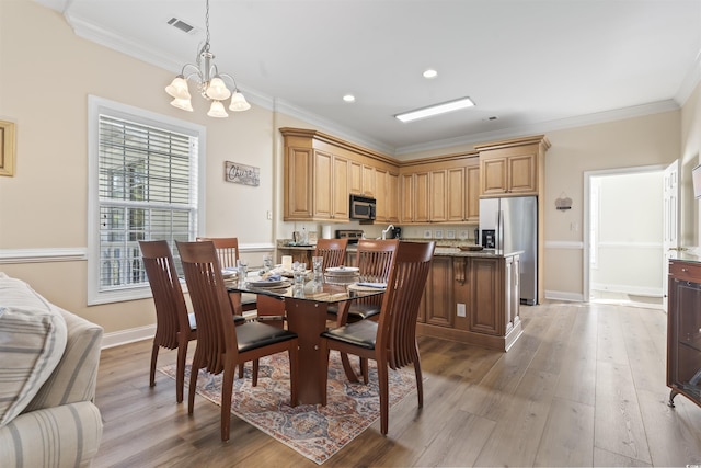 77 Tern Pl Unit 202, Pawleys Island, SC 29585 - dining area with a chandelier, light wood-style flooring, ornamental molding, and recessed lighting