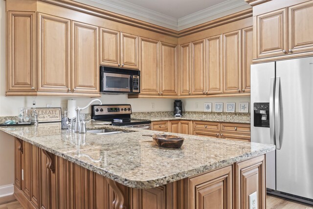 77 Tern Pl Unit 202, Pawleys Island, SC 29585 - kitchen with stainless steel appliances, a peninsula, ornamental molding, light wood-style floors, and light stone counters