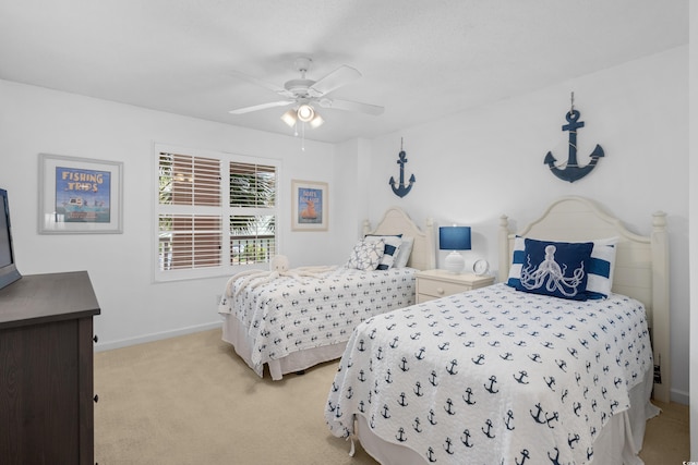 bedroom featuring baseboards, a ceiling fan, and light colored carpet