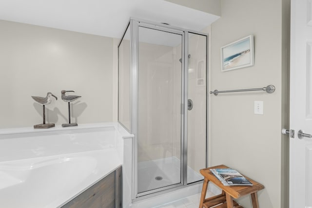 full bathroom with a shower stall