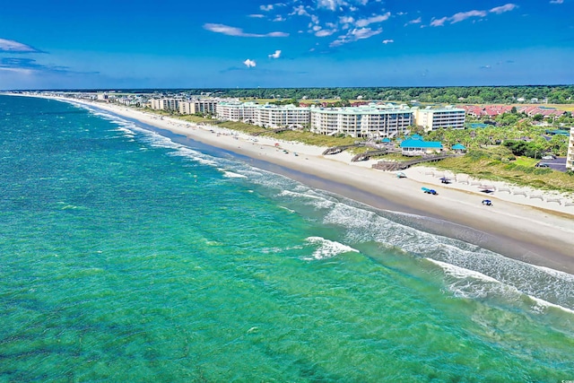 bird's eye view featuring a water view and a view of the beach