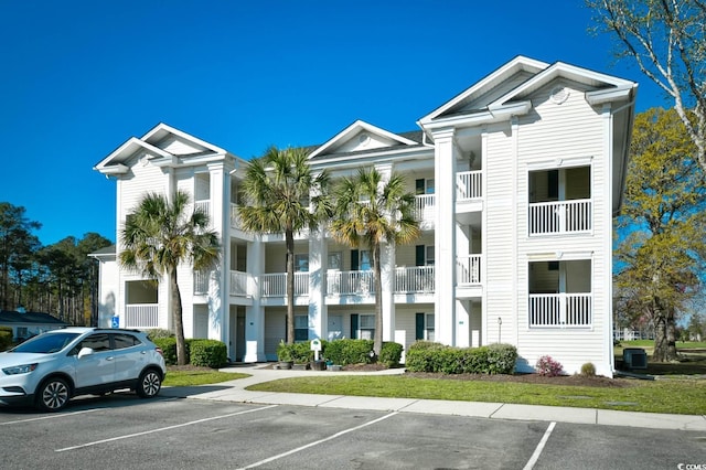 view of property featuring uncovered parking