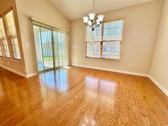 1612 Fairforest Ct, Conway, SC 29526 - unfurnished room featuring a chandelier, healthy amount of natural light, lofted ceiling, and wood finished floors