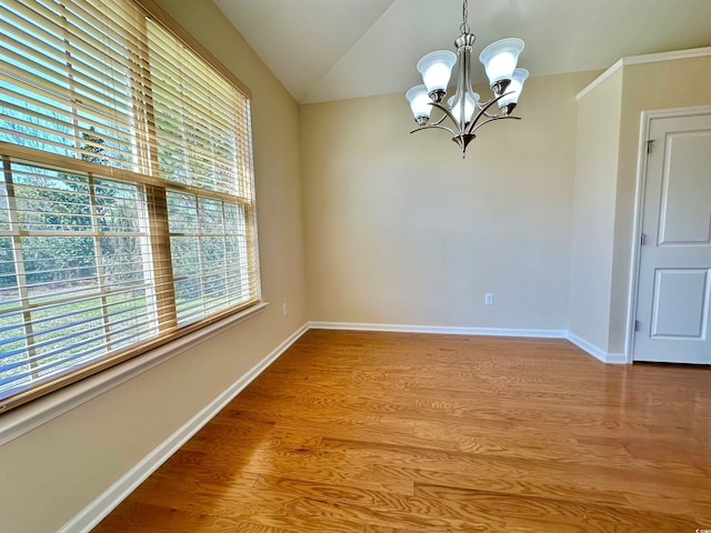 1612 Fairforest Ct, Conway, SC 29526 - empty room with a chandelier, light wood-type flooring, and vaulted ceiling