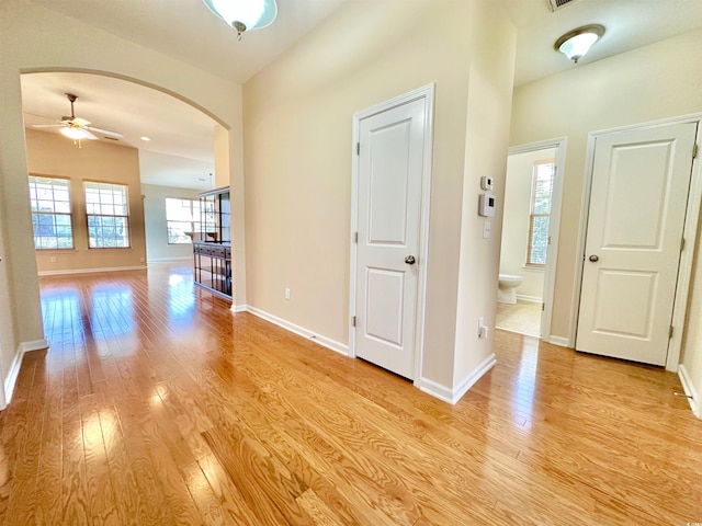 1612 Fairforest Ct, Conway, SC 29526 - entrance foyer with arched walkways, light wood-style flooring, and ceiling fan