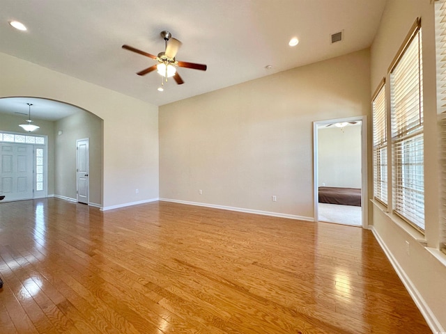 1612 Fairforest Ct, Conway, SC 29526 - empty room with a ceiling fan, wood-type flooring, arched walkways, and recessed lighting
