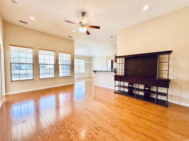 1612 Fairforest Ct, Conway, SC 29526 - unfurnished living room featuring ceiling fan, wood finished floors, a chandelier, and recessed lighting