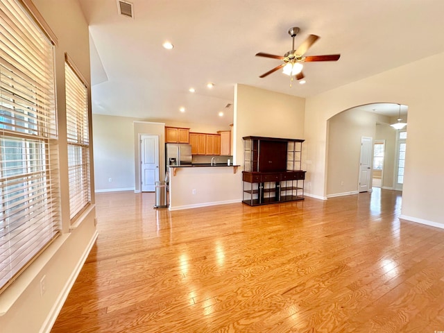 1612 Fairforest Ct, Conway, SC 29526 - unfurnished living room featuring a ceiling fan, arched walkways, light wood-type flooring, and recessed lighting