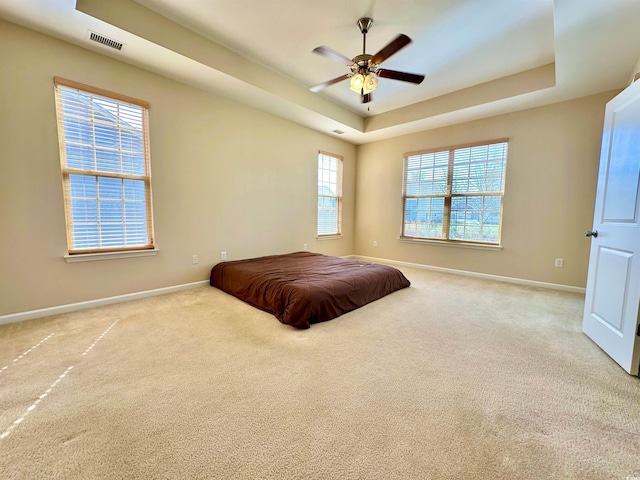 1612 Fairforest Ct, Conway, SC 29526 - carpeted bedroom with a tray ceiling and a ceiling fan