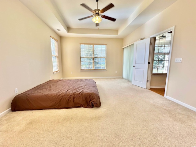 1612 Fairforest Ct, Conway, SC 29526 - bedroom featuring carpet floors, multiple windows, a raised ceiling, and ceiling fan