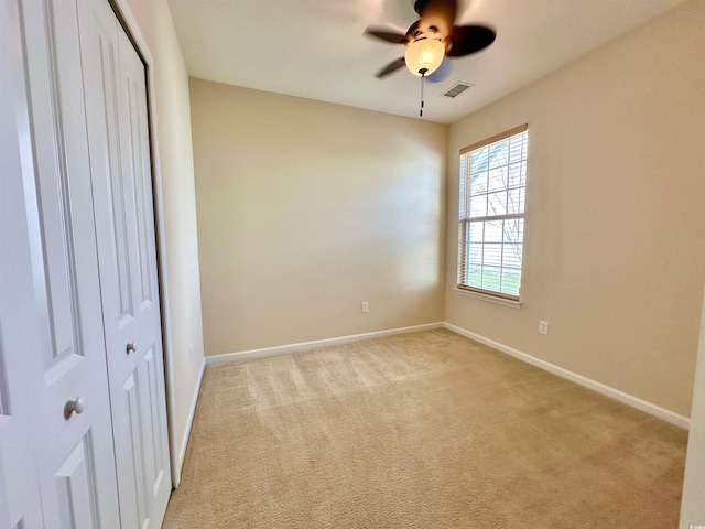 1612 Fairforest Ct, Conway, SC 29526 - unfurnished bedroom with light colored carpet, a closet, and ceiling fan