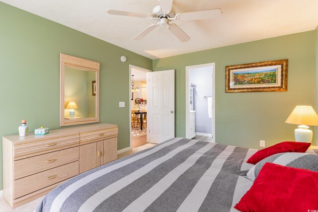 478 Pinehurst Ln Unit 17D, Pawleys Island, SC 29585 - bedroom featuring baseboards, ensuite bathroom, and ceiling fan