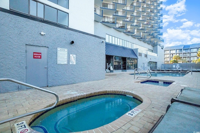 2001 S Ocean Blvd Unit 1505, Myrtle Beach, SC 29577 - community pool featuring a patio area and a hot tub