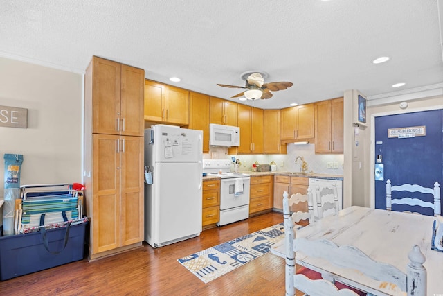 5601 N Ocean Blvd Unit C-311, Myrtle Beach, SC 29577 - kitchen with white appliances, ceiling fan, wood finished floors, ornamental molding, and a sink