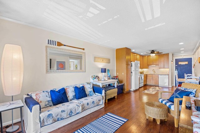 5601 N Ocean Blvd Unit C-311, Myrtle Beach, SC 29577 - living room featuring recessed lighting, ornamental molding, a textured ceiling, light wood-style floors, and a ceiling fan