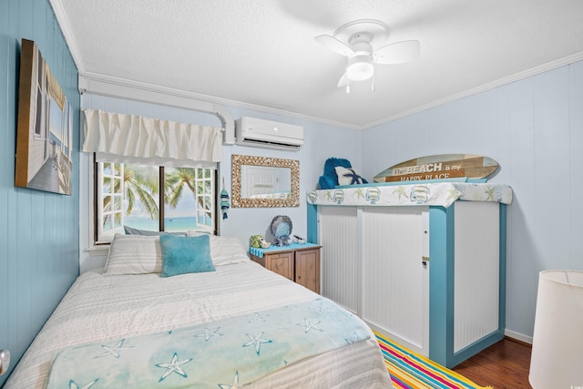 5601 N Ocean Blvd Unit C-311, Myrtle Beach, SC 29577 - bedroom with a wall unit AC, crown molding, a textured ceiling, a ceiling fan, and wood finished floors