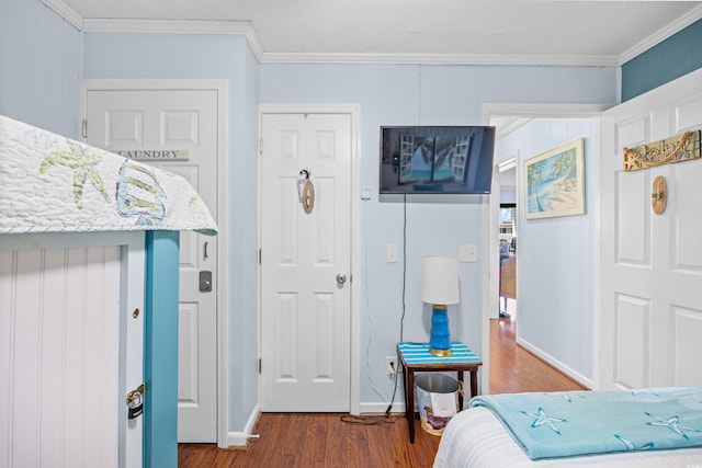 5601 N Ocean Blvd Unit C-311, Myrtle Beach, SC 29577 - bedroom with baseboards, wood finished floors, and crown molding