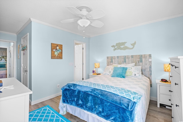 5601 N Ocean Blvd Unit C-311, Myrtle Beach, SC 29577 - bedroom featuring a ceiling fan, light wood-style flooring, crown molding, and baseboards