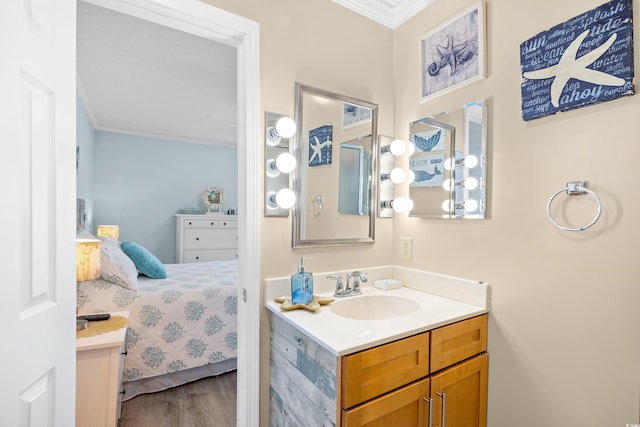 5601 N Ocean Blvd Unit C-311, Myrtle Beach, SC 29577 - bathroom featuring connected bathroom, wood finished floors, vanity, and ornamental molding