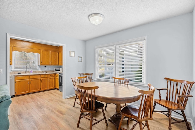 600-B 43rd Ave S, North Myrtle Beach, SC 29582 - dining space with light wood finished floors and a textured ceiling
