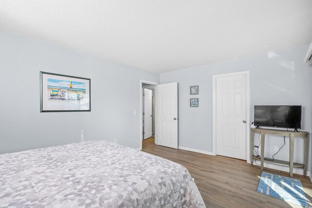 600-B 43rd Ave S, North Myrtle Beach, SC 29582 - bedroom featuring wood finished floors and a textured ceiling